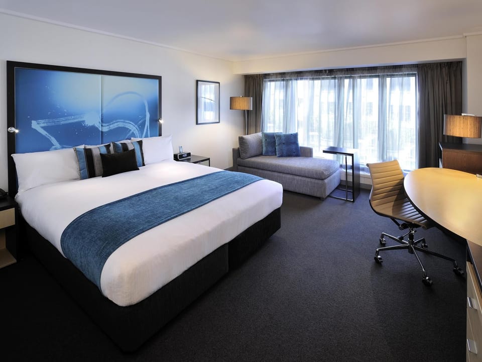Deluxe Room, 1 King Bed | Down comforters, in-room safe, desk, laptop workspace