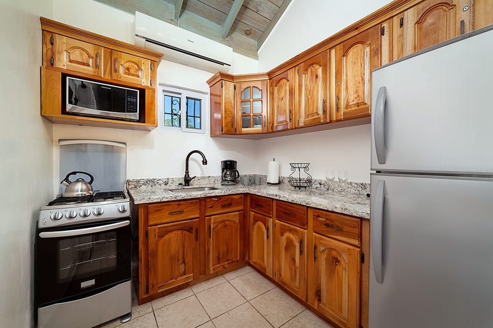Upper Reef House | Private kitchen | Coffee/tea maker, full-size fridge, microwave, oven