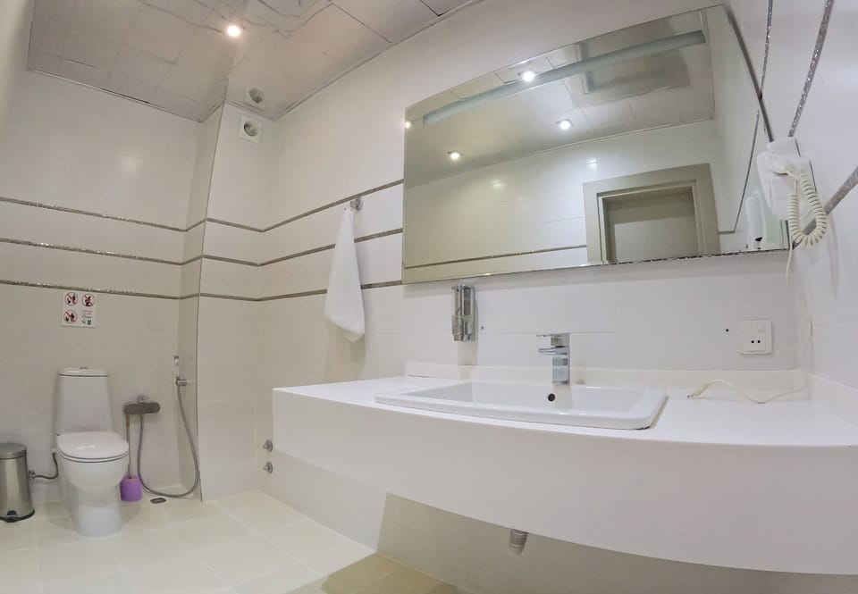 Family Suite | Bathroom | Shower, designer toiletries, hair dryer, slippers