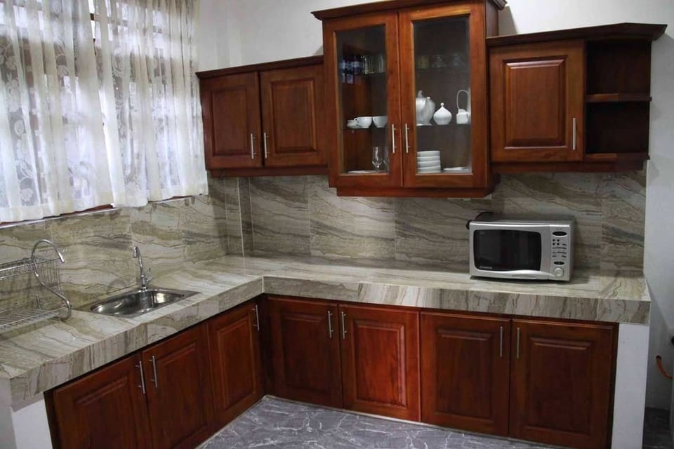 Mini-fridge, rice cooker, cleaning supplies