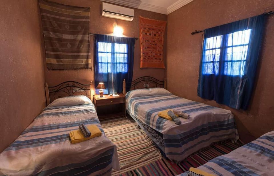 Standard Quadruple Room | Minibar, desk, iron/ironing board, free cribs/infant beds
