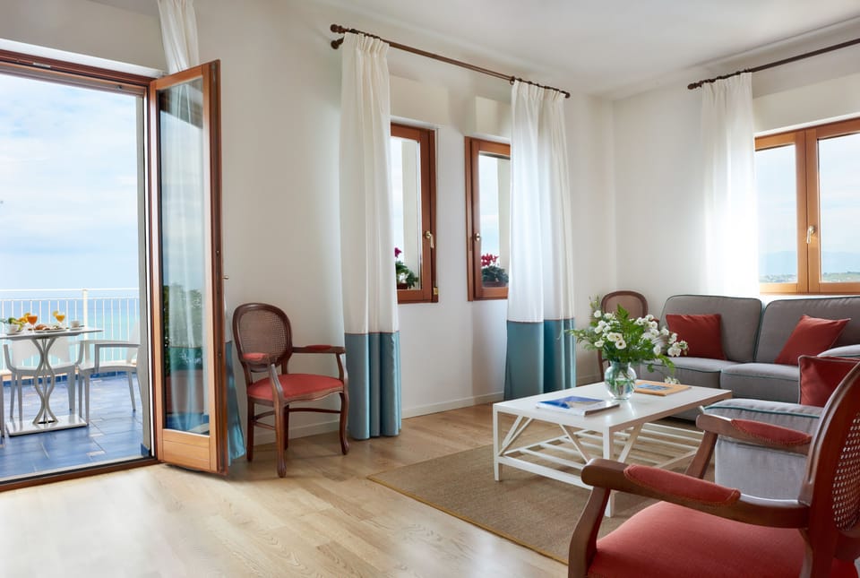 Suite, Sea View | Down comforters, minibar, in-room safe, desk