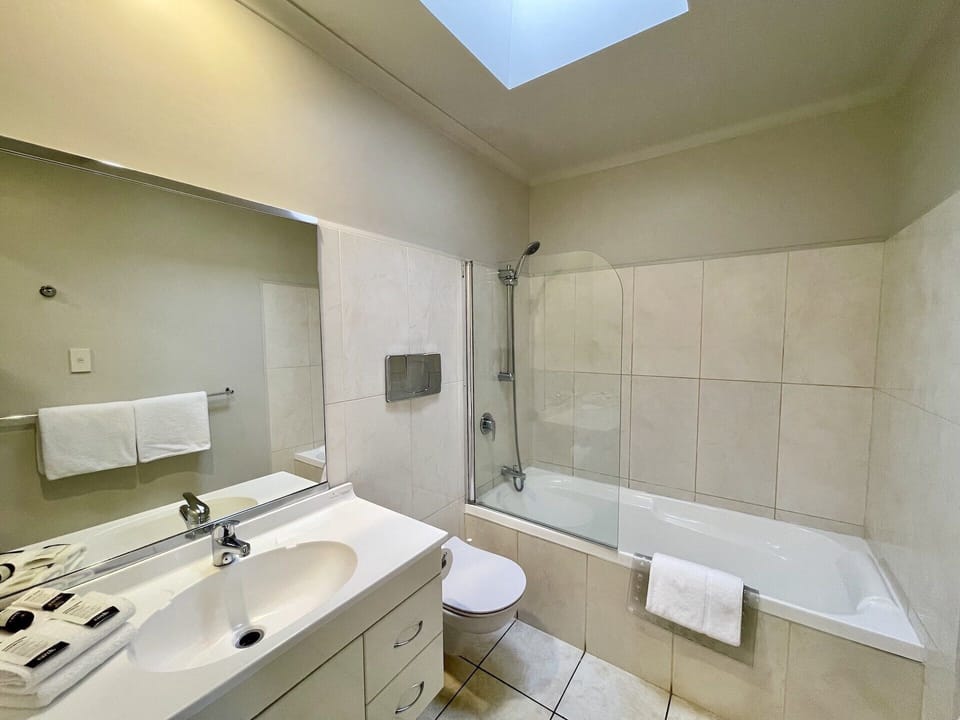 Studio King | Bathroom | Designer toiletries, hair dryer, towels