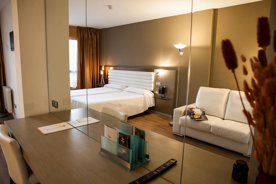 Standard Double Room | Minibar, in-room safe, desk, blackout drapes
