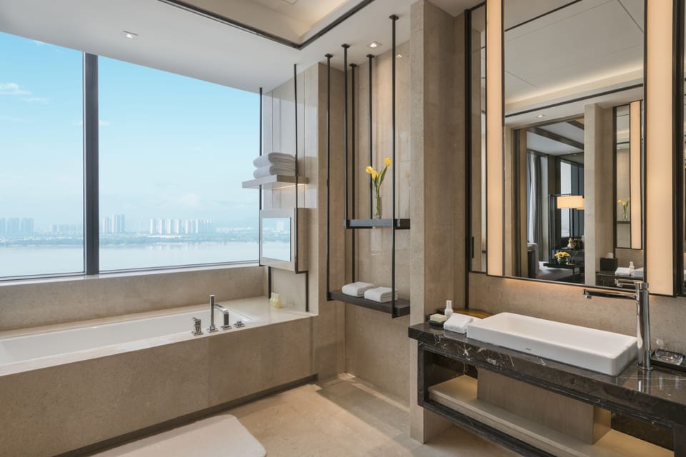  1 King Bed Suite | Bathroom | Separate tub and shower, rainfall showerhead, designer toiletries