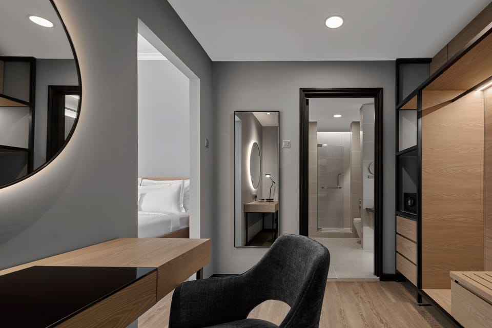 Suite, 1 King Bed with Sofa bed, Non Smoking | Bathroom | Shower, free toiletries, hair dryer, towels