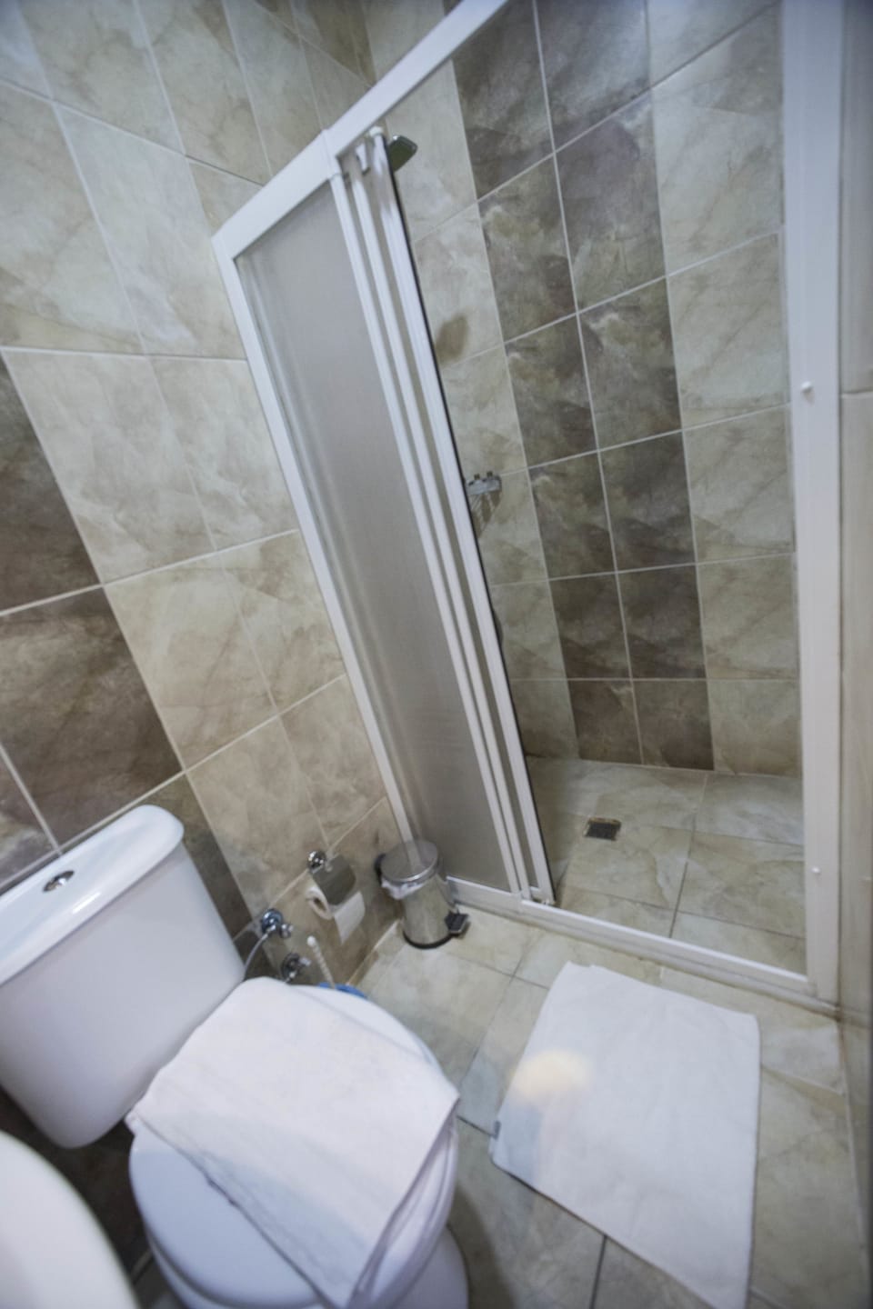 Shower, free toiletries, hair dryer, slippers
