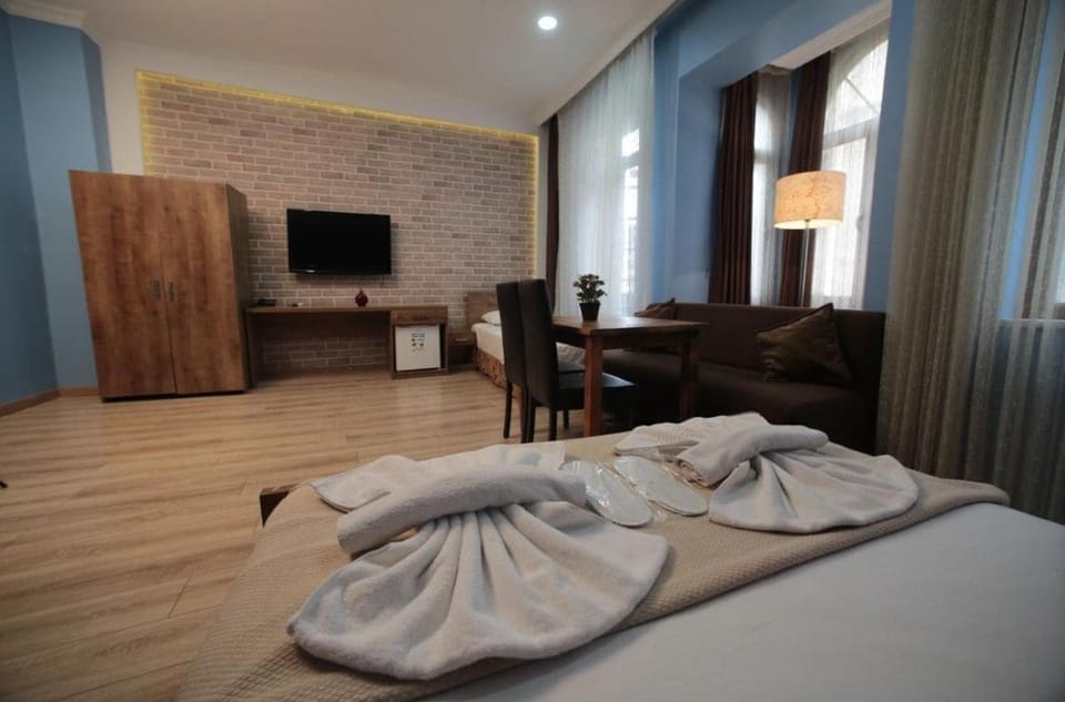 Family Room | 1 bedroom, premium bedding, minibar (free items), in-room safe