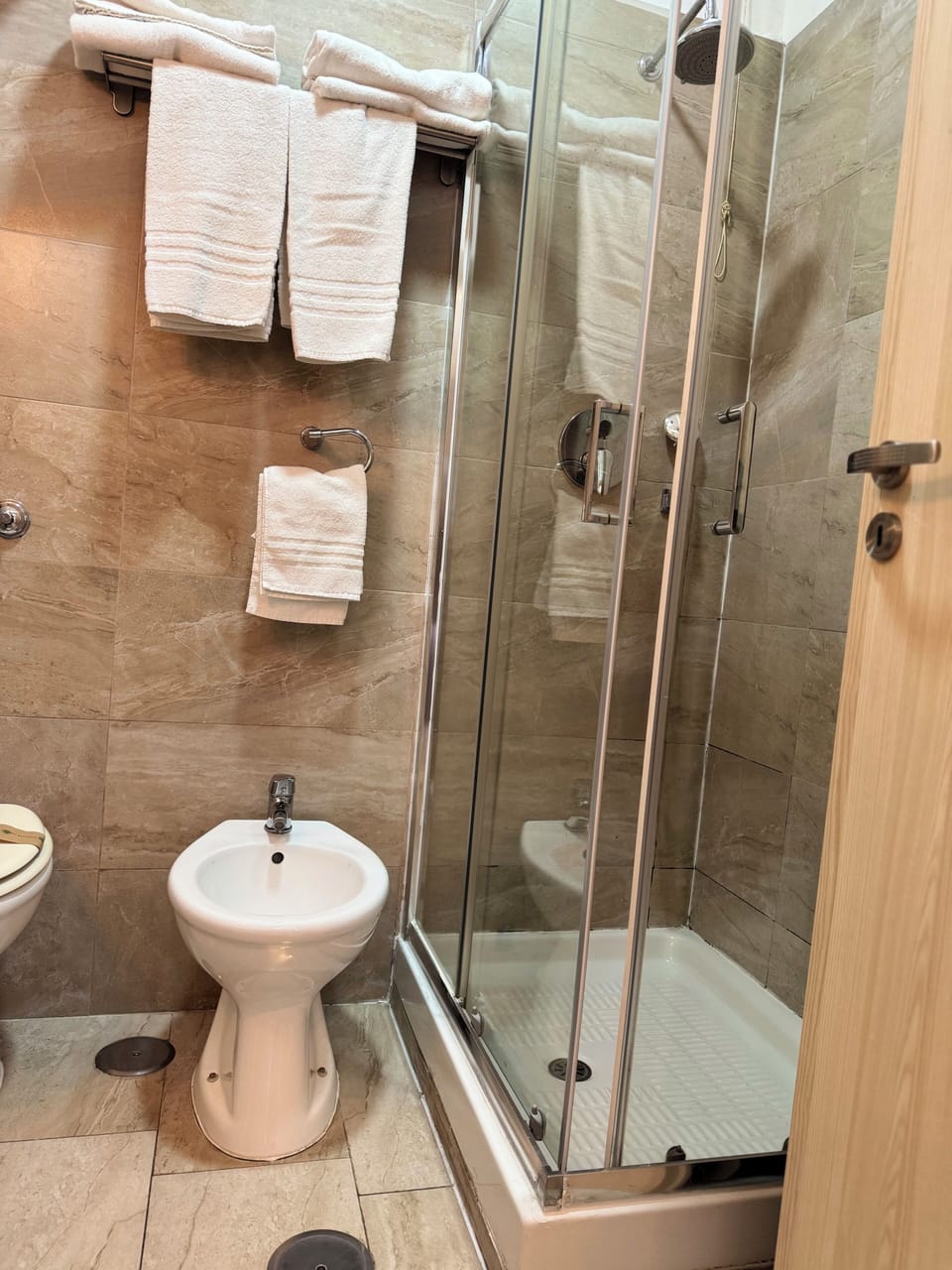 Shower, rainfall showerhead, designer toiletries, hair dryer