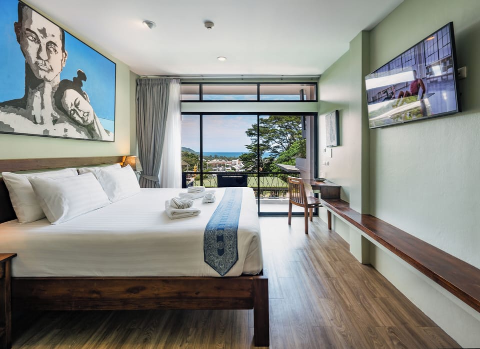 Deluxe Double Room, Ocean View | Minibar, in-room safe, desk, laptop workspace