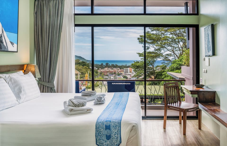 Deluxe Double Room, Ocean View | Minibar, in-room safe, desk, laptop workspace