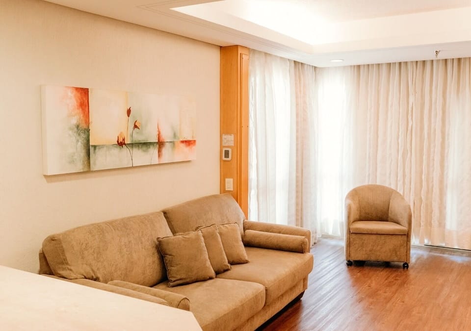Suite | Living area | 32-inch LCD TV with cable channels, TV