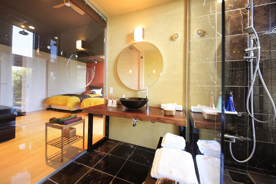 Japanese Western Twin Room with Open Air Bath (2 Beds + 2 Japanese Futons) | Bathroom | Hair dryer, slippers, electronic bidet, towels