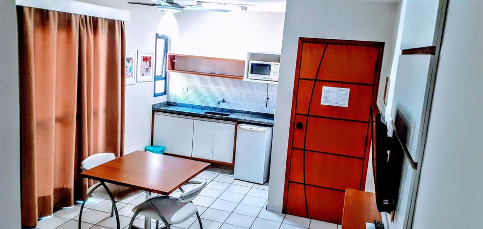 Family Room | Private kitchenette | Microwave, cookware/dishes/utensils, dining tables
