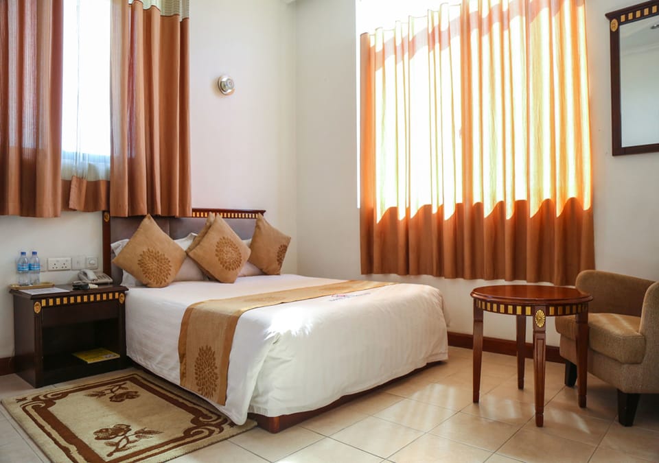Deluxe Double Room | Minibar, in-room safe, individually decorated, desk