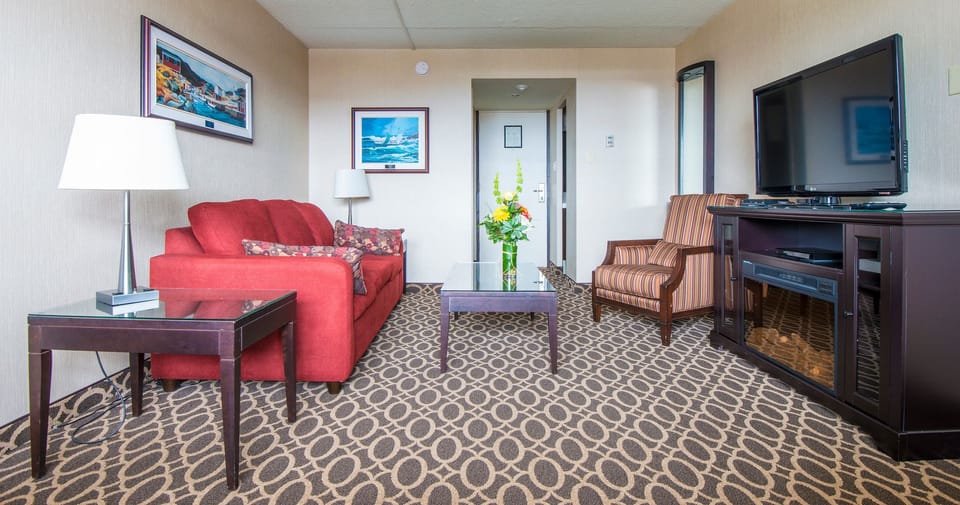 Suite, 1 King Bed with Sofa bed | Living area | 42-inch flat-screen TV with cable channels, TV