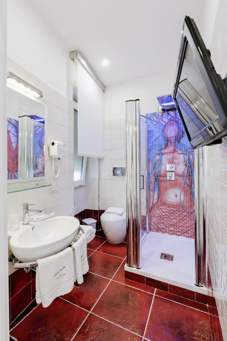 Shower, free toiletries, hair dryer, slippers