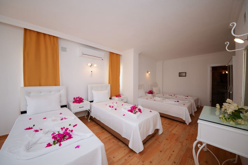 Signature Quadruple Room, Garden Area | Desk, WiFi (free), bed sheets