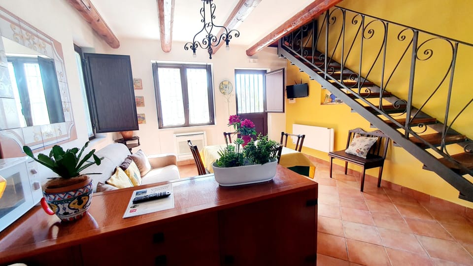 Comfort Apartment, Kitchen, Garden View | Private kitchen | Fridge, highchair, dining table