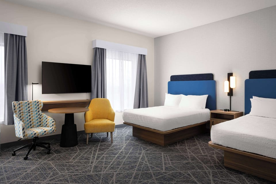 Suite, 2 Queen Beds, Non Smoking | Iron/ironing board, free cribs/infant beds, free rollaway beds