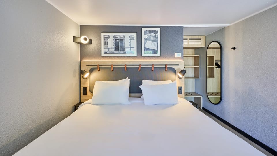 Premium bedding, desk, laptop workspace, blackout drapes