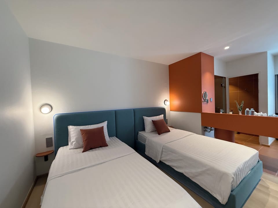 Standard Twin Room, 2 Twin Beds | Minibar, blackout drapes, free WiFi, bed sheets