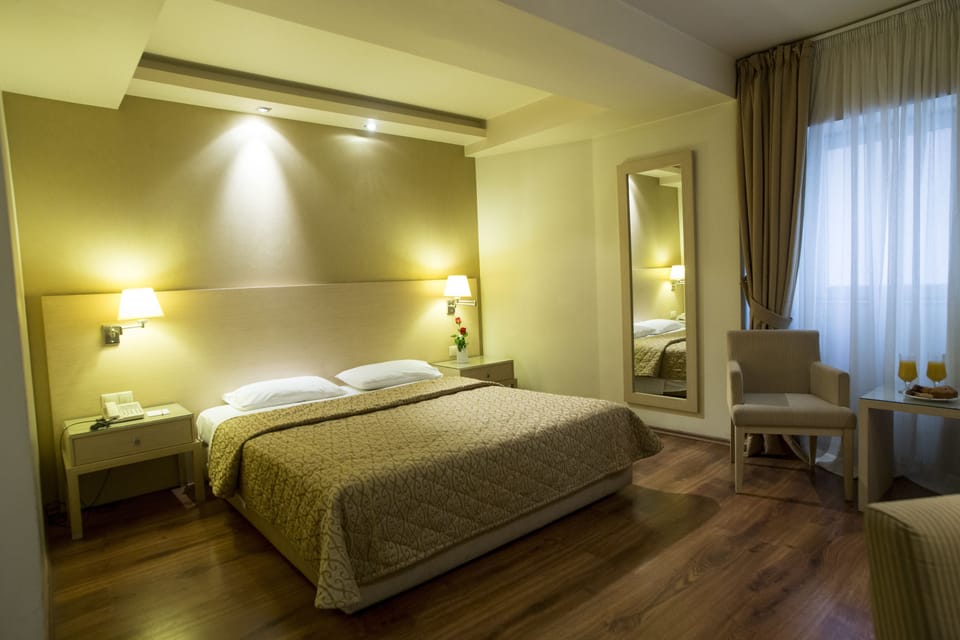 Double Room | Minibar, in-room safe, desk, blackout drapes