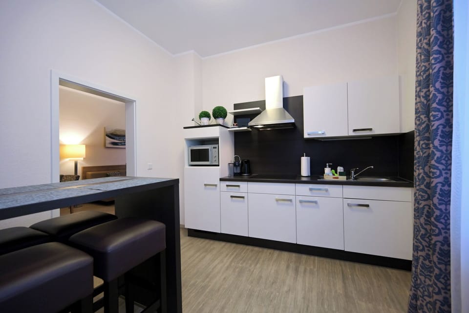 Comfort Apartment, Kitchen, Annex Building (Wormser Str. 11) | Private kitchen | Shared fridge, microwave