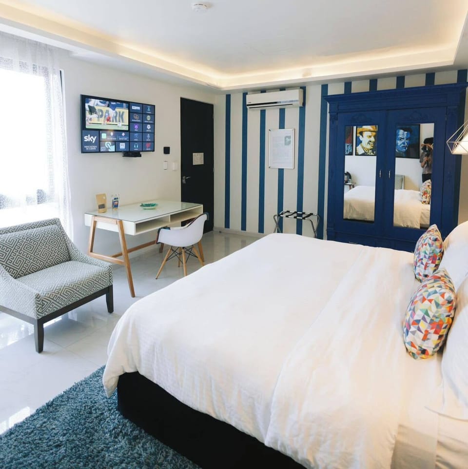 Deluxe King Room | Premium bedding, down comforters, in-room safe, individually decorated