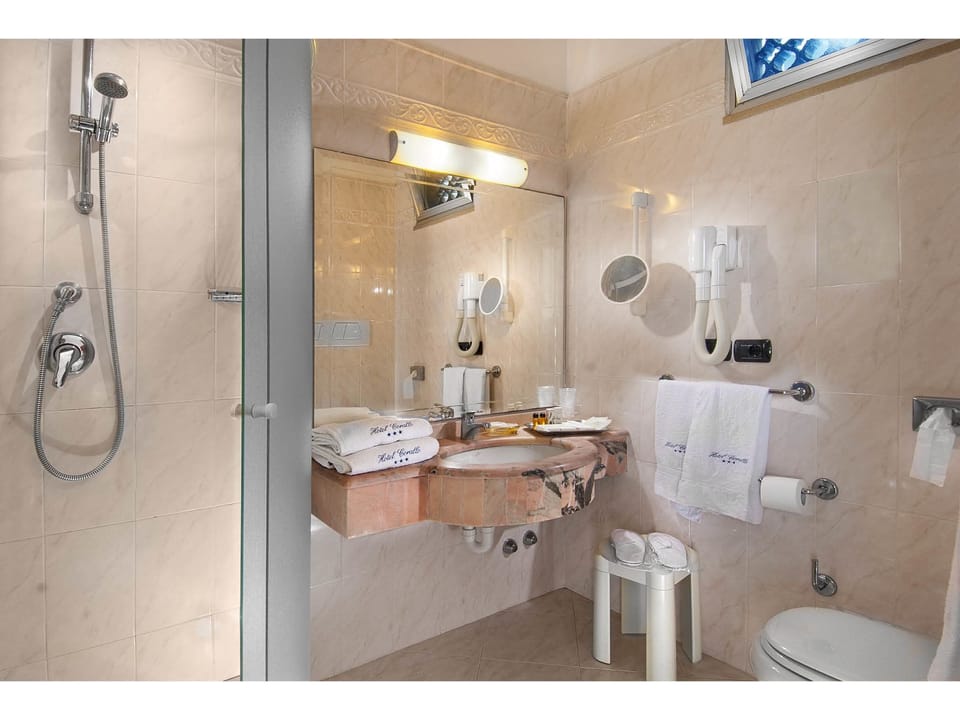 Separate tub and shower, jetted tub, free toiletries, hair dryer