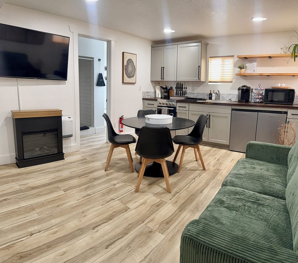 Deluxe Suite | Living area | 65-inch Smart TV with cable channels, streaming services