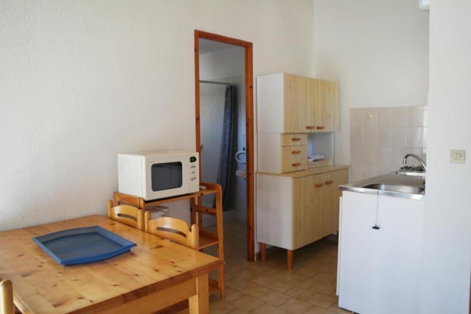 Apartment, 1 Bedroom | Private kitchen | Fridge, microwave, stovetop, coffee/tea maker
