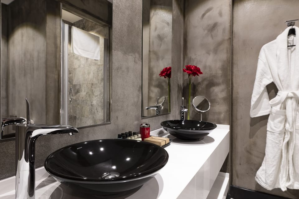 Junior Studio Suite, 1 King Bed, Balcony, City View | Bathroom sink