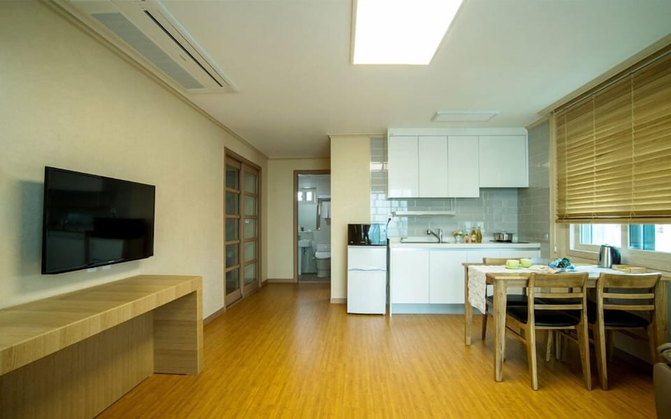 Family Room, 1 Bedroom, Kitchenette, Partial Sea View | Living area | 40-inch flat-screen TV with cable channels, TV, pay movies