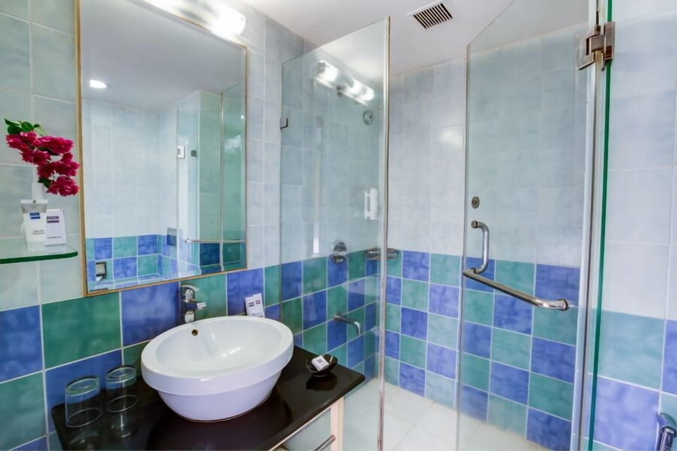 Shower, free toiletries, hair dryer, slippers