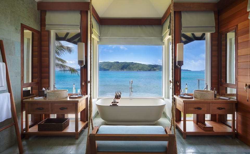 Separate tub and shower, rainfall showerhead, designer toiletries