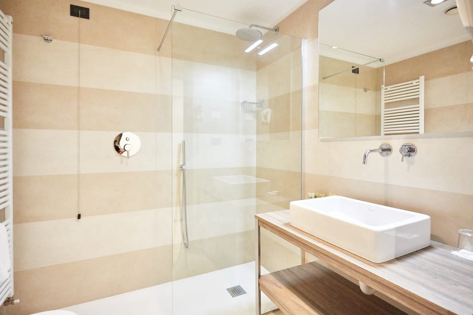 Rainfall showerhead, free toiletries, hair dryer, slippers