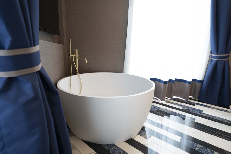 Suite, Sea View | Minibar, in-room safe, desk, blackout drapes
