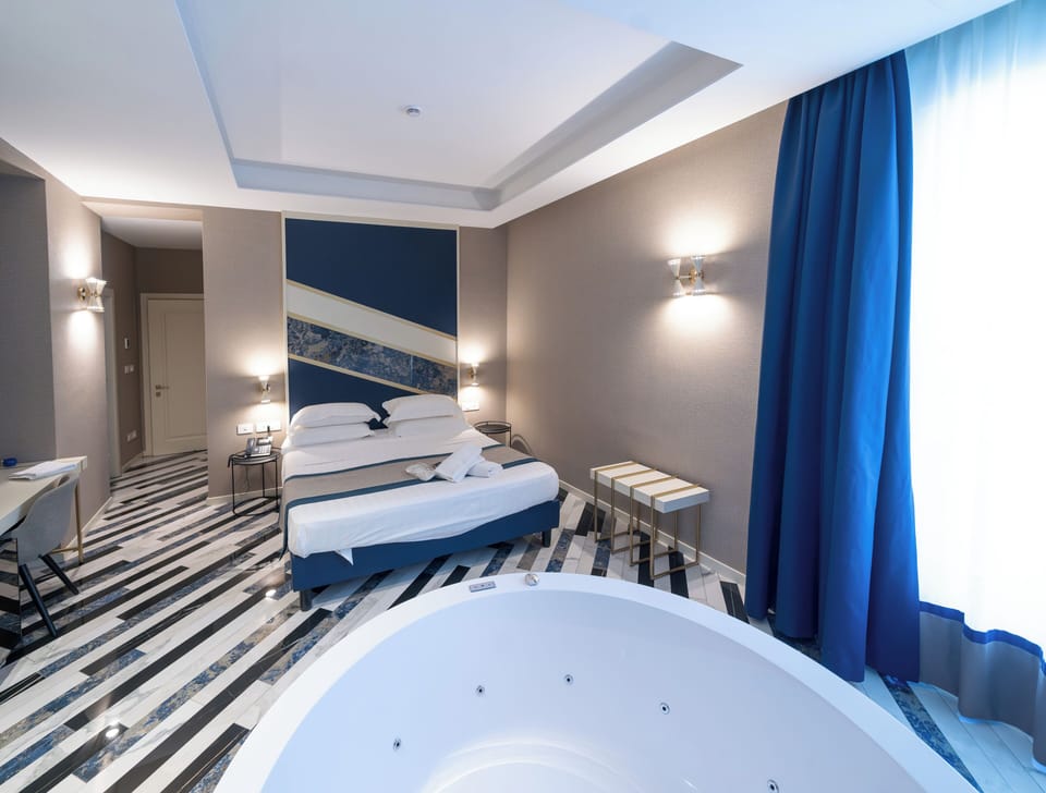 Deluxe Room, 1 Double Bed | Minibar, in-room safe, desk, blackout drapes