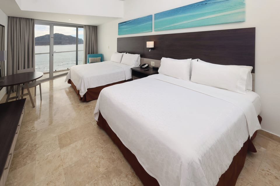 Premium bedding, down comforters, in-room safe, desk
