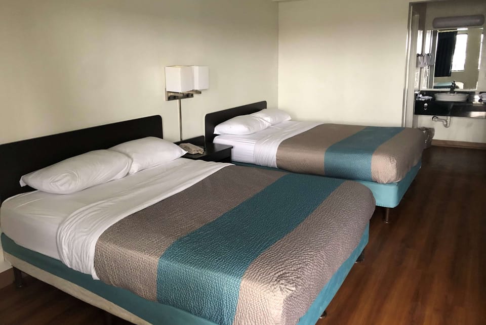 Room, 2 Queen Beds, Non Smoking | Desk, rollaway beds (surcharge), WiFi (free), bed sheets
