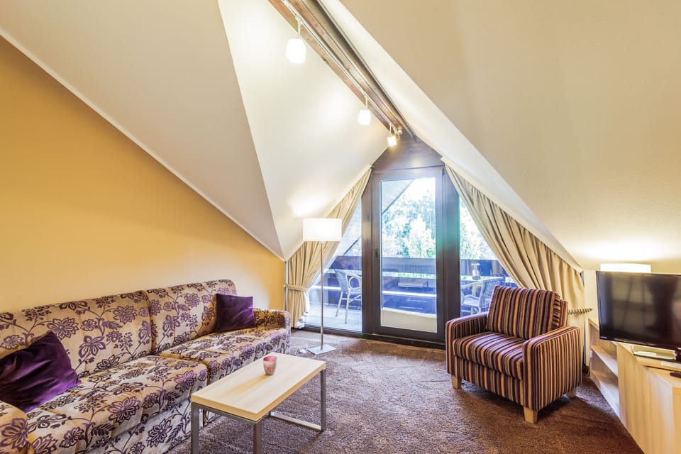 Junior Suite (Main Building) | Living area | 70-cm flat-screen TV with satellite channels, TV