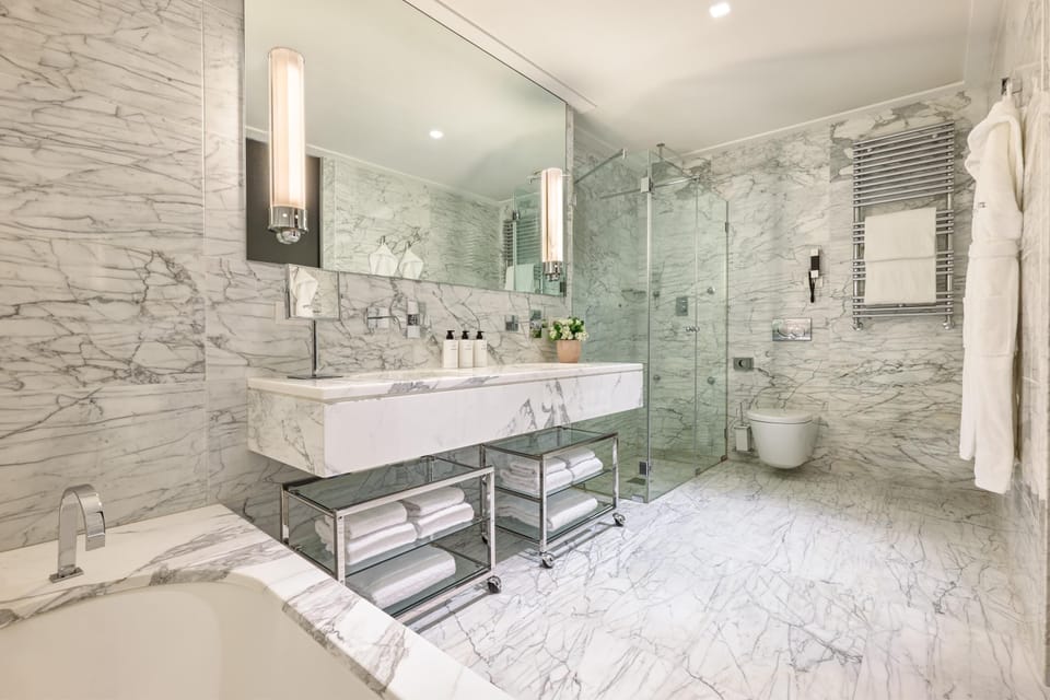 Combined shower/tub, deep soaking tub, designer toiletries, hair dryer