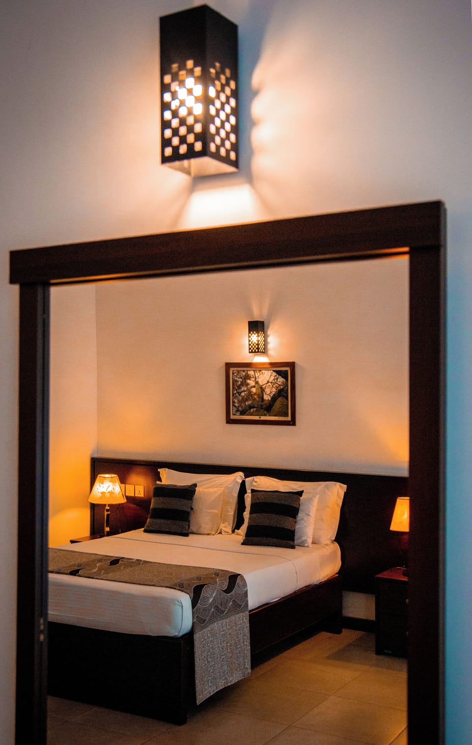 Deluxe Triple Room | Minibar, in-room safe, desk, iron/ironing board