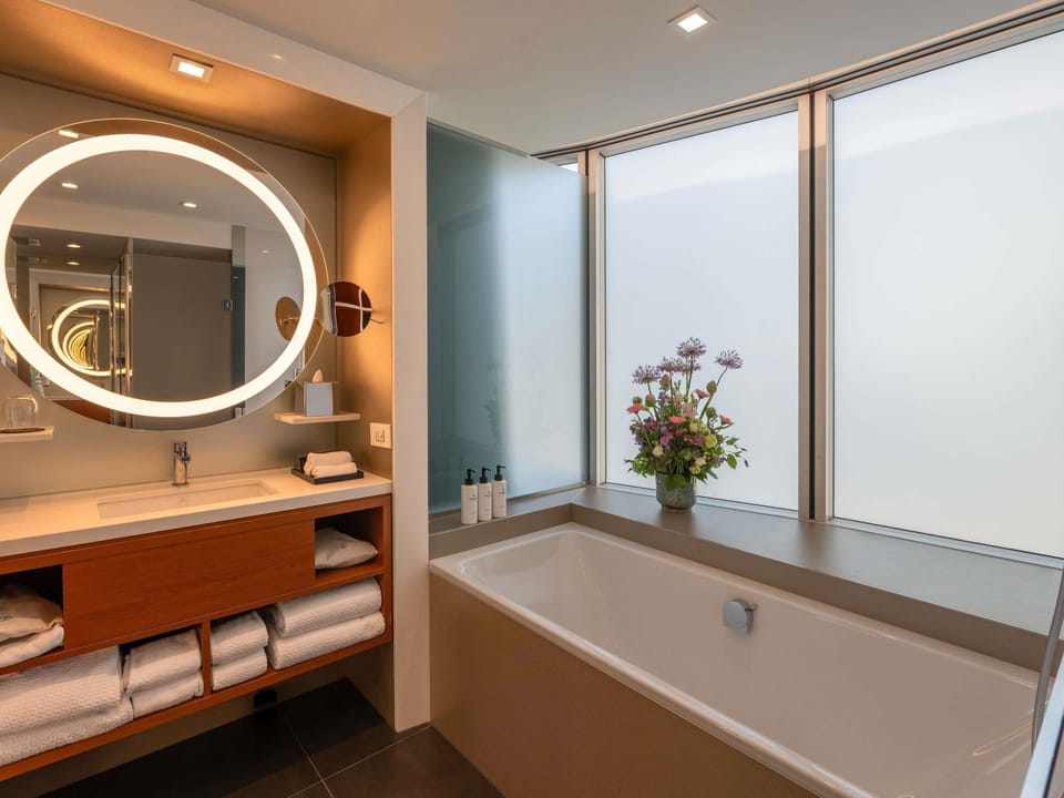 Junior Suite, 1 King Bed (Large Work Space) | Bathroom | Separate tub and shower, designer toiletries, hair dryer, bathrobes