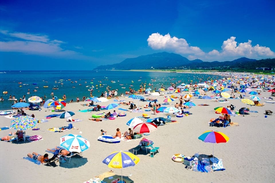 Beach nearby, beach umbrellas, beach volleyball