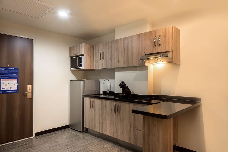 Suite, 1 King Bed, Non Smoking, Refrigerator | Private kitchen | Fridge, coffee/tea maker