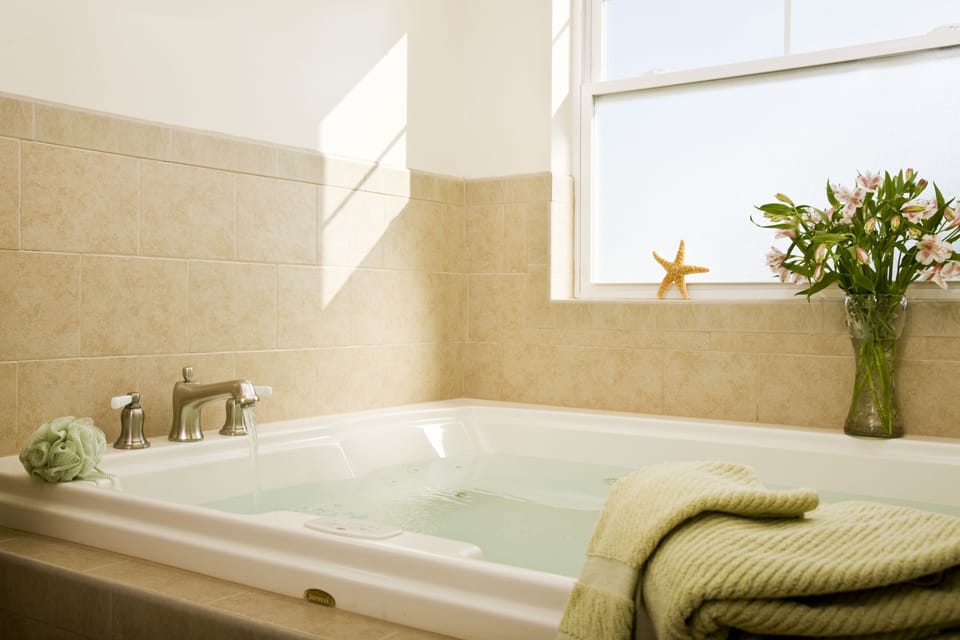 Suite, 1 Queen Bed (Jacuzzi  and Fireplace) | Deep soaking bathtub