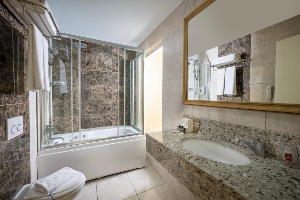 Shower, free toiletries, hair dryer, towels