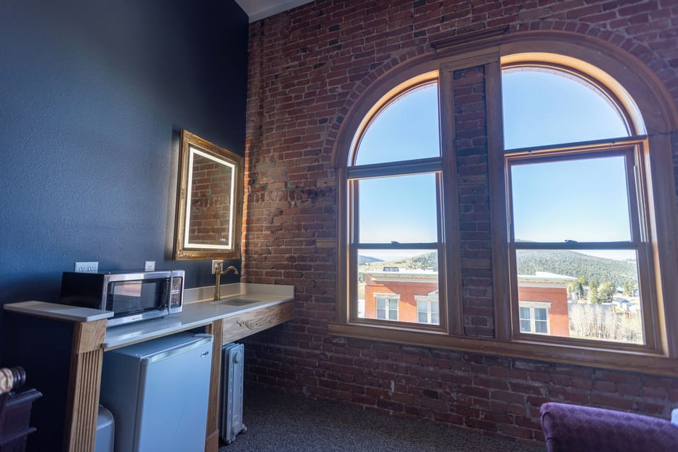 Deluxe Room, 1 Queen Bed (Top Floor) | Desk, laptop workspace, iron/ironing board, cribs/infant beds